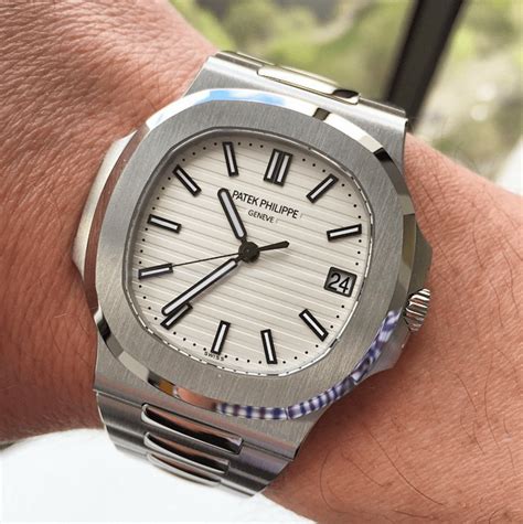 patek philippe nautilus on wrist white suit